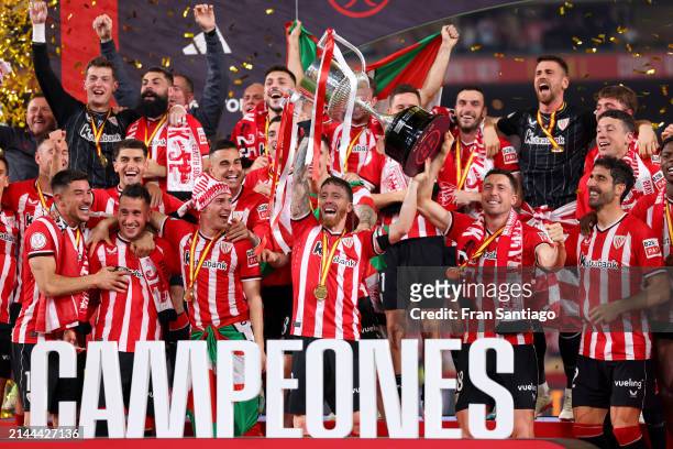 Iker Muniain of Athletic Club lifts the Copa Del Rey trophy in victory following the Copa Del Rey Final between Athletic Club and Real Mallorca at...