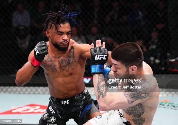 Morgan Charriere of France punches Chepe Mariscal in a featherweight fight during the UFC Fight Night event at UFC APEX on April 06, 2024 in Las...