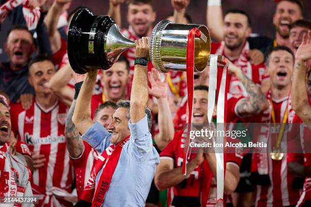 Ernesto Valverde, head coach of Athletic Club, lifts the Copa Del Rey trophy in celebration of victory following the Copa del Rey Final between...