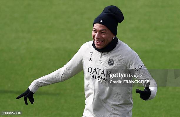 Paris Saint-Germain's French forward Kylian Mbappe reacts during a training session in Poissy, west of Paris, on April 9 on the eve of their UEFA...