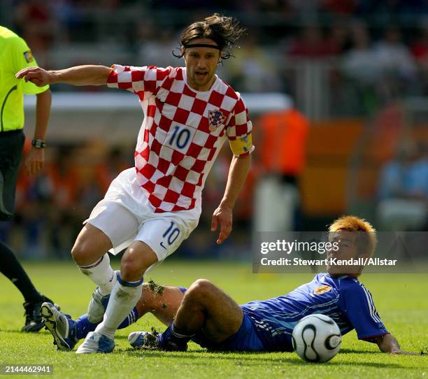 June 18: Niko Kovac of Croatia and Akira Kaji of Japan challenge during the FIFA World Cup Finals 2006 Group F match between Japan and Croatia at...