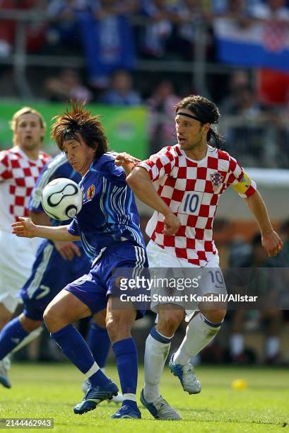 June 18: Masashi Oguro of Japan and Niko Kovac of Croatia challenge during the FIFA World Cup Finals 2006 Group F match between Japan and Croatia at...