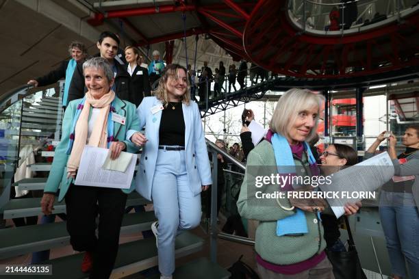 Members of Swiss association Senior Women for Climate Protection react after the announcement of decisions after a hearing of the European Court of...