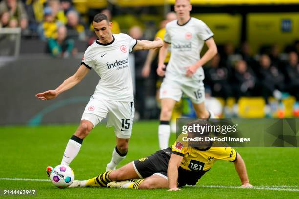 Ellyes Skhiri of Eintracht Frankfurt and Niclas Fuellkrug of Borussia Dortmund battle for the ball during the Bundesliga match between Borussia...