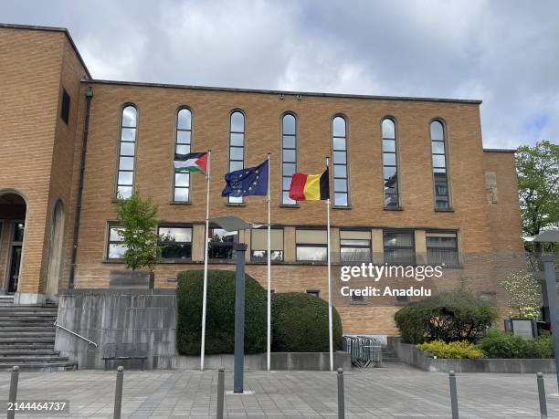 The Palestinian flag, which was hoisted at the Evere Municipality and taken down by unidentified persons, is raised again next to the flags of the...