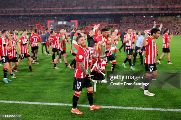 Iker Muniain of Athletic Club celebrates with the Copa Del Rey trophy following victory in the Copa Del Rey Final between Athletic Club and Real...