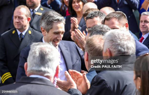 Fine Gael leader and Ireland's incoming Prime Minster Simon Harris is greeted by colleagues and family members as he leaves the Dail, the lower house...