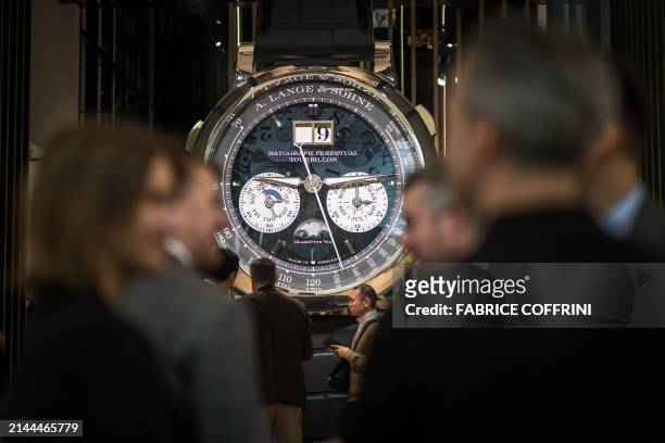 This photograph taken on April 9 shows a giant watch by German manufacturer of luxury and prestige watches A Lange & Sohne displayed during the...