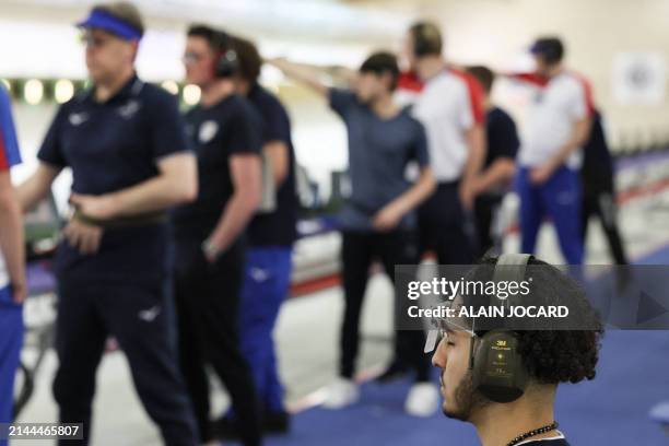 French athlete Yacine Ouchani concentrates during the 10 meters air pistol men competition as part of a test event prior to the Paris 2024 Olympic...