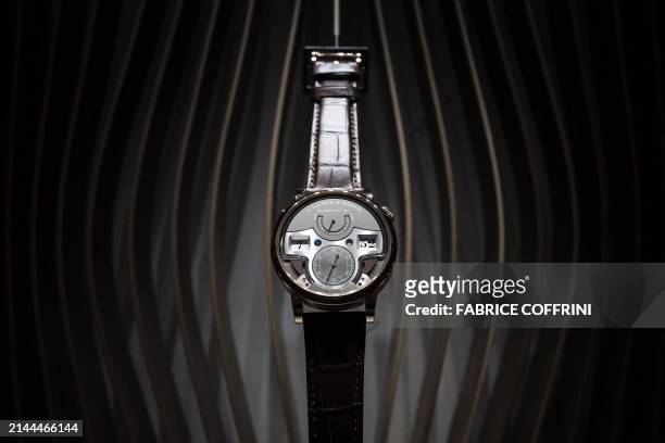 This photograph taken on April 9 shows a watch by German manufacturer of luxury and prestige watches A Lange & Sohne displayed during the opening day...