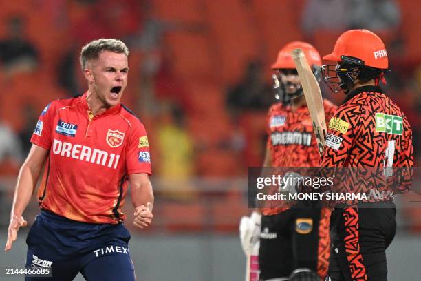 Punjab Kings' Sam Curran celebrates after taking the wicket of Sunrisers Hyderabad's Abhishek Sharma during the Indian Premier League Twenty20...