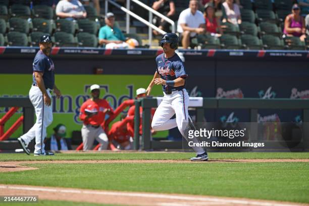 Skye Bolt of the Atlanta Braves scores on a double hit by Ozzie Albies during the sixth inning of a spring training game against the Boston Red Sox...