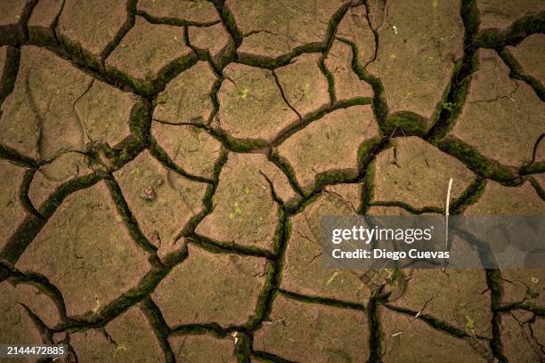 Footprint is seen on a now dry section of reservoir bed at Embalse La Regadera due to its historic low in the town of Usme on April 8, 2024 in...