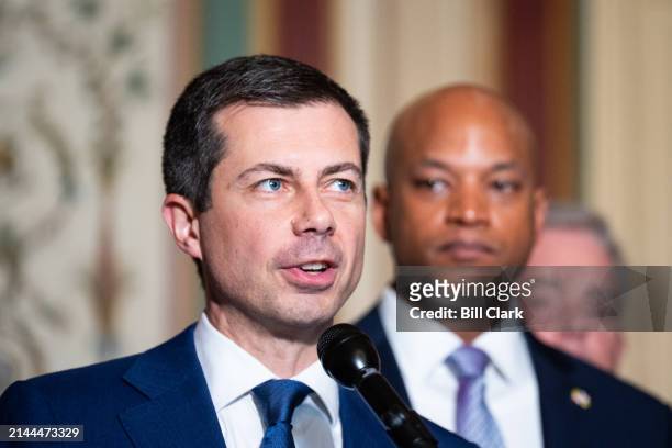 From left, Secretary of Transportation Pete Buttigieg and Gov. Wes Moore, D-Md., speak during the news conference following the Maryland delegation's...