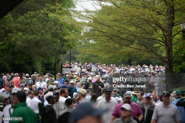 Fans walk near the golf shop prior to Masters Tournament at Augusta National Golf Club on April 9, 2024 in AUGUSTA, Georgia.