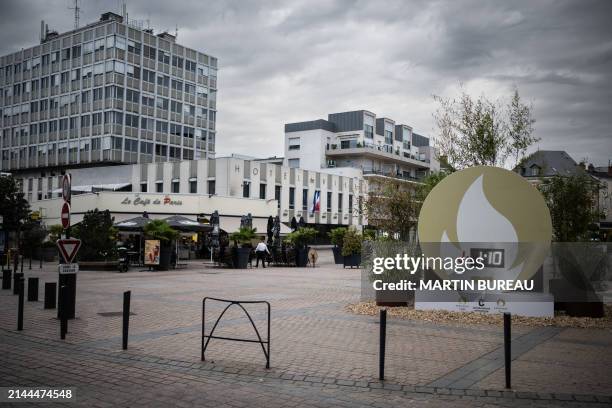 This photograph taken on April 7, 2024 shows the Olympic Clock near the city hall of Chateauroux, central France, near Deols, where the Paris 2024...