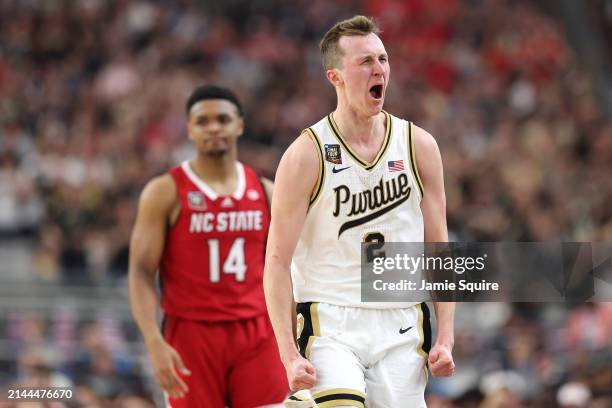Fletcher Loyer of the Purdue Boilermakers celebrates in the second half against the North Carolina State Wolfpack in the NCAA Men's Basketball...