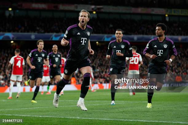 Bayern Munich's English striker Harry Kane celebrates with teammates after scoring his team second goal during the UEFA Champions League quarter...