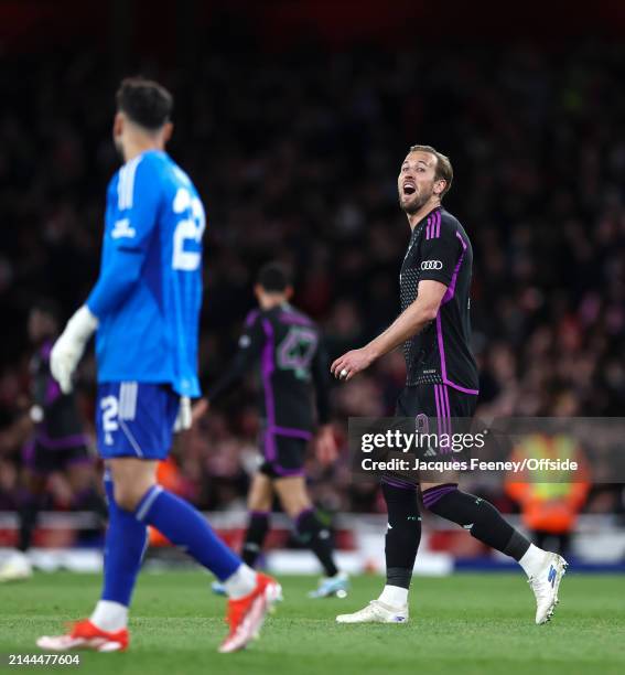 Harry Kane of Bayern Munich looks towards Arsenal goalkeeper David Raya with a smile after scoring their 2nd goal from the penalty spot during the...