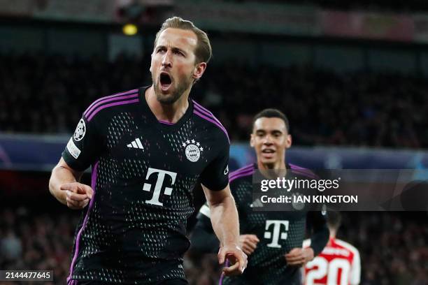 Bayern Munich's English striker Harry Kane celebrates with teammates after scoring his team second goal during the UEFA Champions League quarter...