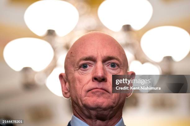 Sen. Mark Kelly listens during a news conference following a Senate Democratic party policy luncheon at the U.S. Capitol Building on April 9, 2024 in...