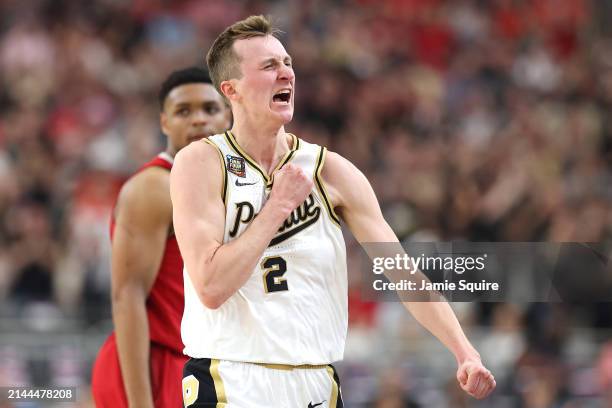 Fletcher Loyer of the Purdue Boilermakers celebrates in the second half against the North Carolina State Wolfpack in the NCAA Men's Basketball...