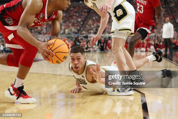 Mason Gillis of the Purdue Boilermakers dives after a loose ball in the second half against the North Carolina State Wolfpack in the NCAA Men's...