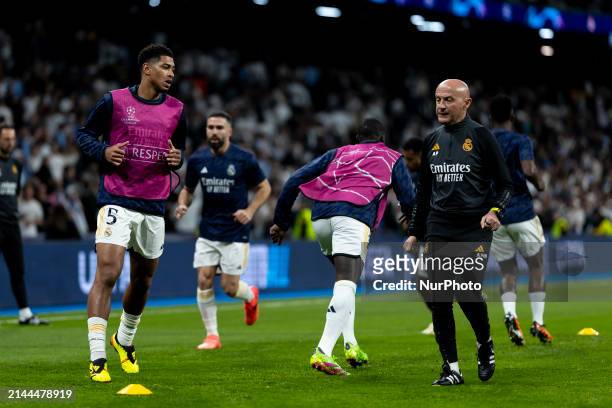Jude Bellingham of Real Madrid is with Antonio Pintus during the UEFA Champions League quarter-final first leg match between Real Madrid CF and...