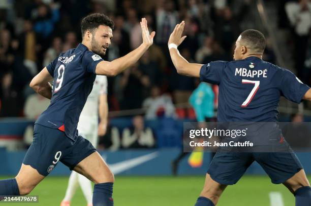 Goncalo Ramos of PSG celebrates his goal with Kylian Mbappe of PSG during the Ligue 1 Uber Eats match between Paris Saint-Germain and Clermont Foot...