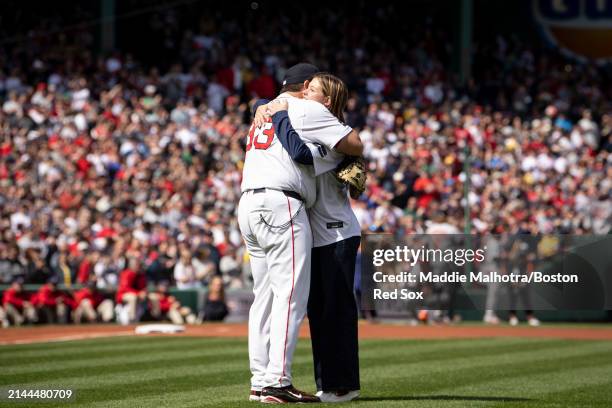 Brianna Wakefield, daughter of former Boston Red Sox pitch Tim Wakefield, reacts with Game Planning Coordinator and Catching Coach Jason Varitek of...