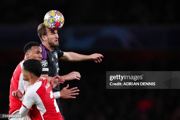 Bayern Munich's English striker Harry Kane heads the ball during the UEFA Champions League quarter final first-leg football match between Arsenal and...