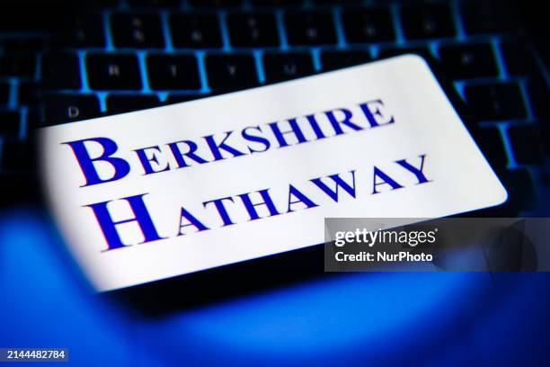 Berkshire Hathaway logo is screened on a mobile phone for illustration photo. Krakow, Poland on April 9th, 2024