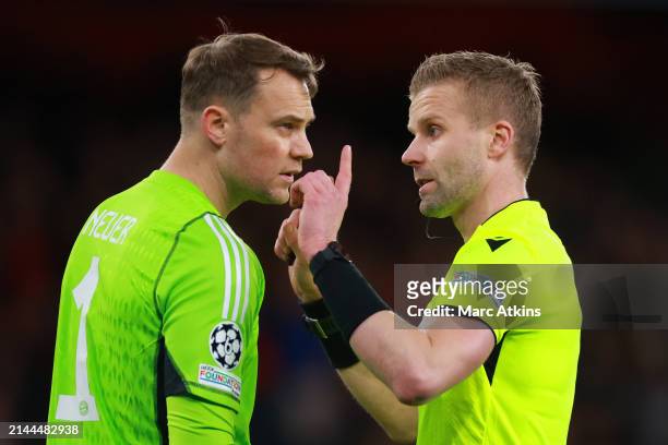 Manuel Neuer of Bayern Munich with Referee Glenn Nyberg during the UEFA Champions League quarter-final first leg match between Arsenal FC and FC...