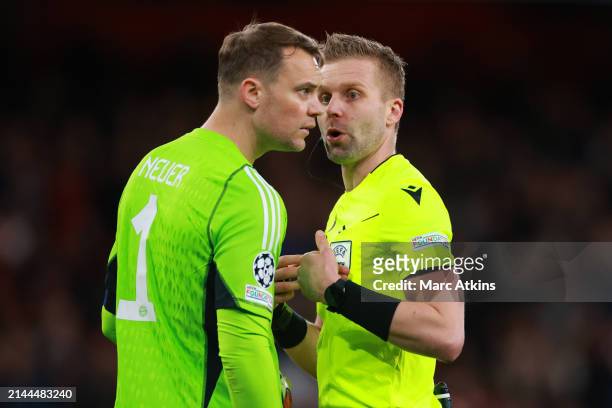 Manuel Neuer of Bayern Munich with Referee Glenn Nyberg during the UEFA Champions League quarter-final first leg match between Arsenal FC and FC...