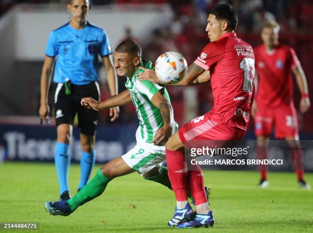 Racing's forward Dylan Nandin and Argentinos Juniors' defender Tobias Palacio fight for the ball during the Copa Sudamericana group stage first leg...