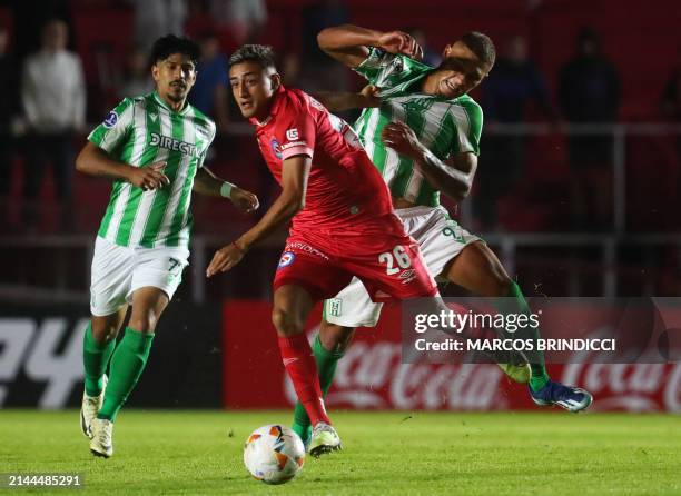 Argentinos Juniors' forward Jose Maria Herrera and Racing's forward Dylan Nandin fight for the ball during the Copa Sudamericana group stage first...