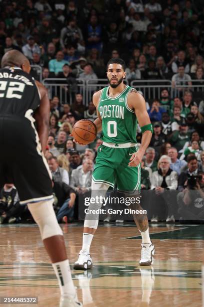 Jayson Tatum of the Boston Celtics dribbles the ball during the game against the Milwaukee Bucks on April 9, 2024 at the Fiserv Forum Center in...