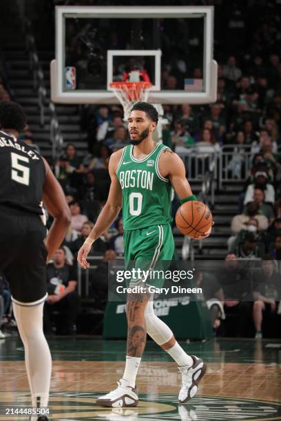 Jayson Tatum of the Boston Celtics dribbles the ball during the game against the Milwaukee Bucks on April 9, 2024 at the Fiserv Forum Center in...