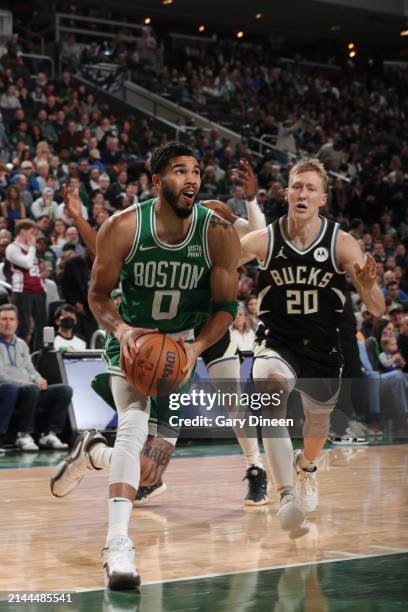 Jayson Tatum of the Boston Celtics drives to the basket during the game against the Milwaukee Bucks on April 9, 2024 at the Fiserv Forum Center in...