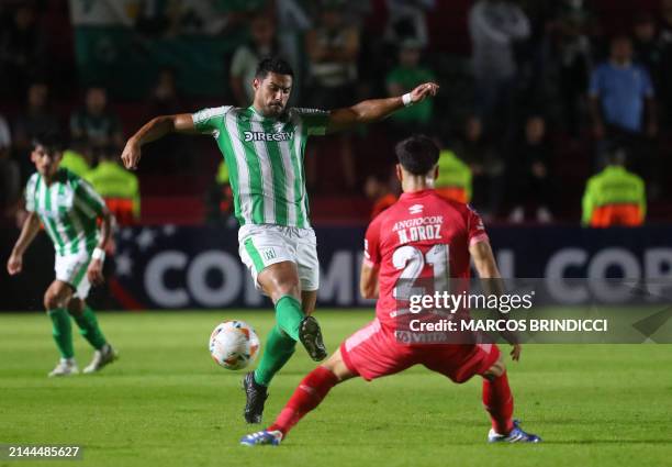 Racing's midfielder Lucas Rodriguez and Argentinos Juniors' midfielder Nicolas Oroz fight for the ball during the Copa Sudamericana group stage first...