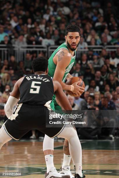 Jayson Tatum of the Boston Celtics handles the ball during the game against the Milwaukee Bucks on April 9, 2024 at the Fiserv Forum Center in...