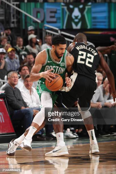Jayson Tatum of the Boston Celtics dribbles the ball during the game against the Milwaukee Bucks on April 9, 2024 at the Fiserv Forum Center in...