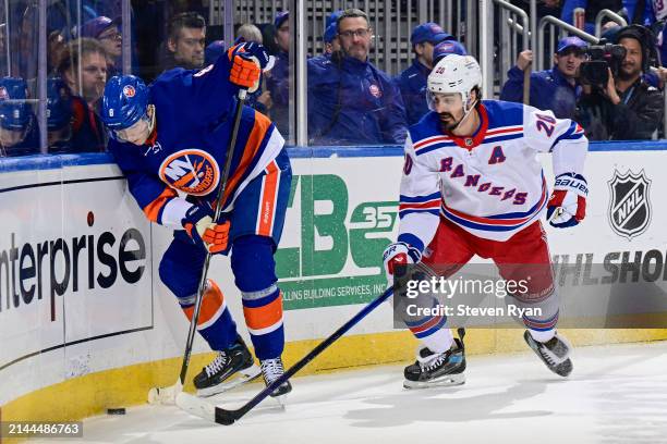 Noah Dobson of the New York Islanders is pursued by Chris Kreider of the New York Rangers \d2p at UBS Arena on April 09, 2024 in Elmont, New York.