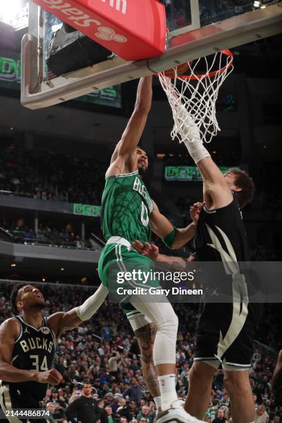 Jayson Tatum of the Boston Celtics dunks the ball during the game against the Milwaukee Bucks on April 9, 2024 at the Fiserv Forum Center in...