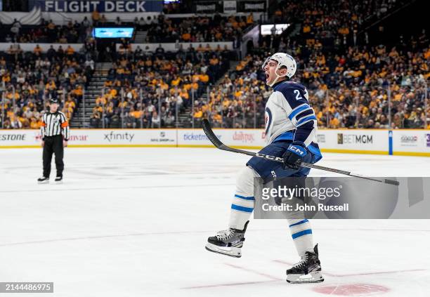 Dylan DeMelo of the Winnipeg Jets celebrates his goal against the Nashville Predators during an NHL game at Bridgestone Arena on April 9, 2024 in...
