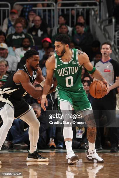 Jayson Tatum of the Boston Celtics dribbles the ball during the game against the Milwaukee Bucks on April 9, 2024 at the Fiserv Forum Center in...