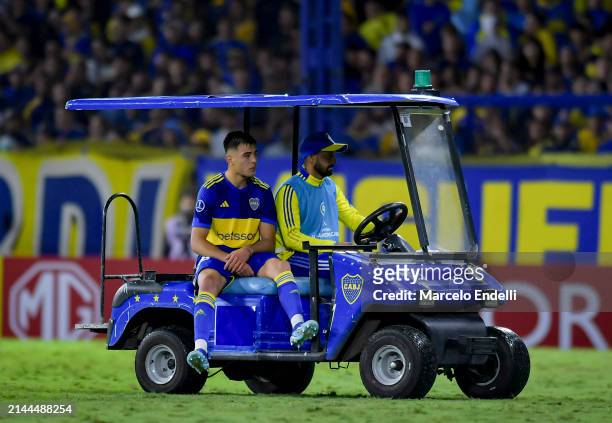 Aaron Anselmino of Boca Juniors leaves the pitch after being injured during the Copa CONMEBOL Sudamericana 2024 group D match between Boca Juniors...