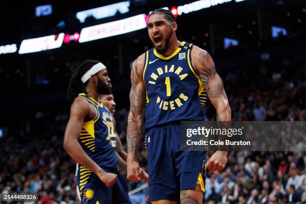 Obi Toppin of the Indiana Pacers reacts after dunking against the Toronto Raptors during the second half of their NBA game at Scotiabank Arena on...