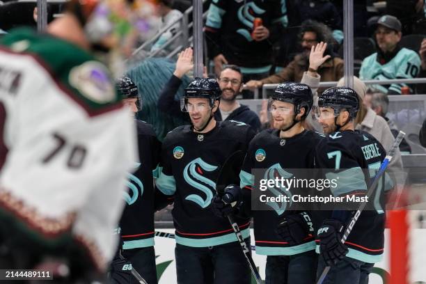 Shane Wright of the Seattle Kraken celebrates with teammates after scoring a goal during the first period of a game against the Arizona Coyotes at...