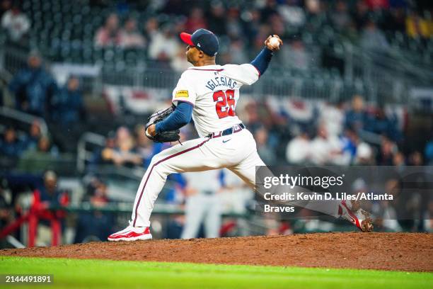 Raisel Iglesias of the Atlanta Braves pitches during the ninth inning against the New York Mets at Truist Park on April 9 2024 in Atlanta, Georgia.